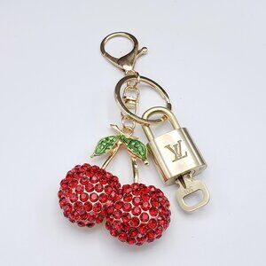Authentic Louis Vuitton Lock & Key with Unbranded Fruit Charm, Keychain